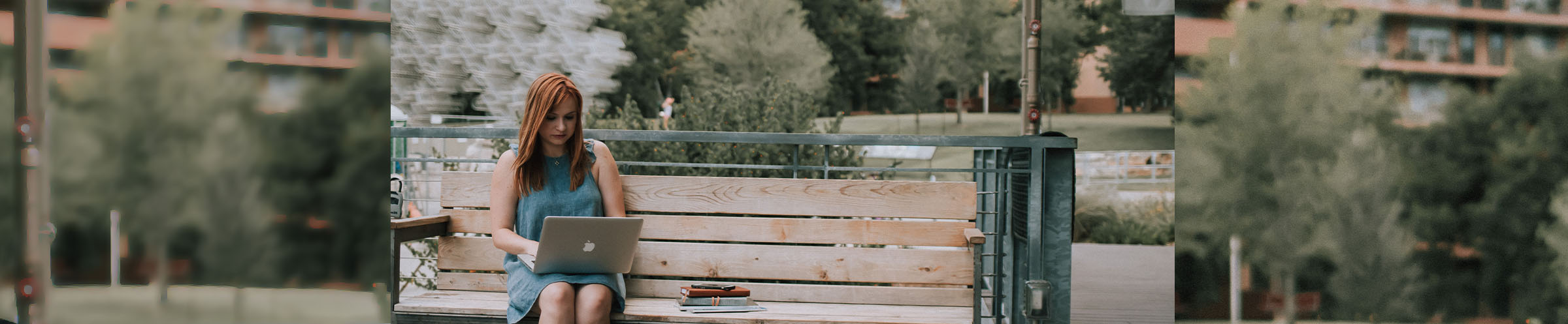 Girl on a bench with computer